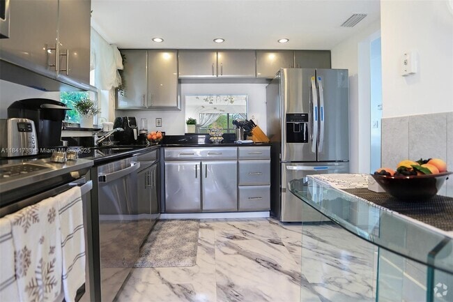 Building Photo - 6570 Royal Palm Blvd Unit 301J Rental