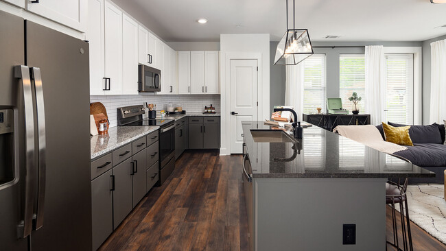 Expansive Kitchen Islands with Granite Countertops - Cortland West Nashville Apartments