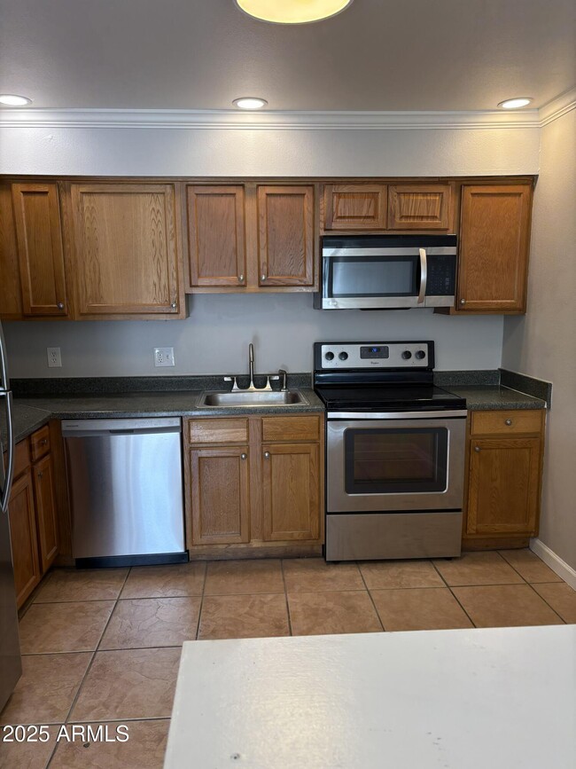 Building Photo - 909 S Priest Dr Unit 10