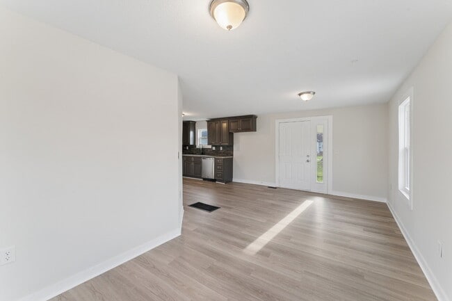 Photo - This cozy residence features a bright living space and well-appointed kitchen.  1st month is FREE...