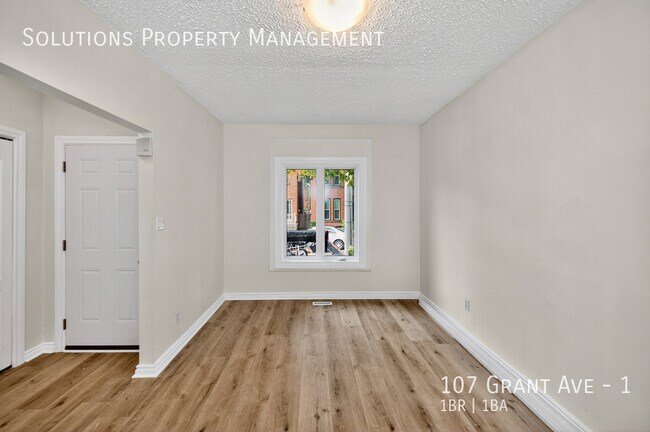 Photo - **Newly Updated Bright Main Floor, 1 Bed + Den** Unit 1