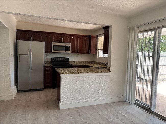 Photo - West 81st Place, Hialeah, FL 33014 - 4 BR 2.5 BA townhouse