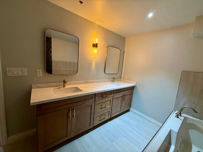 Master bathroom with double vanities, large tub, rain and massage shower - 6221 Monterey Rd Unit East
