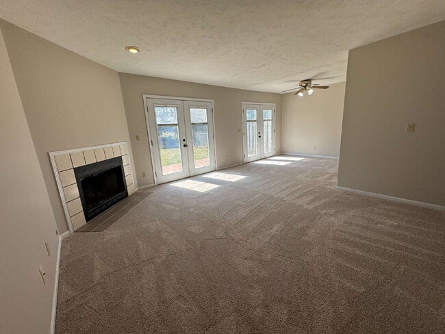 Photo - Modern Comfort: 3 Bed, 2 Bath Home with Fireplace and Fenced Backyard