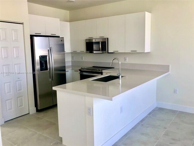 Building Photo - 6455 NW 103rd Pl Unit 301