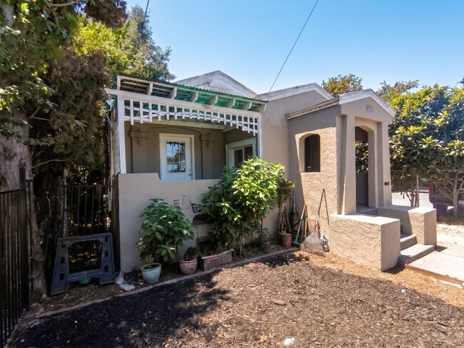 Building Photo - Modern Upgrades w/ Classic Oakland Charm & Driveway Leading to Rear Yard