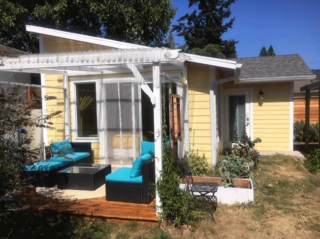 The outdoor covered furnished patio expands your useable space - 3405 NE 80th Ave Unit NEPortland/Roseway