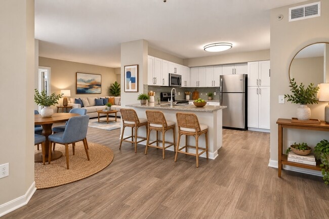 Elevate your lifestyle at Manatee Bay with this stylish kitchen and inviting dining area, perfect for entertaining. Enjoy modern finishes and spacious layouts designed for comfort and convenience. Schedule a tour today!