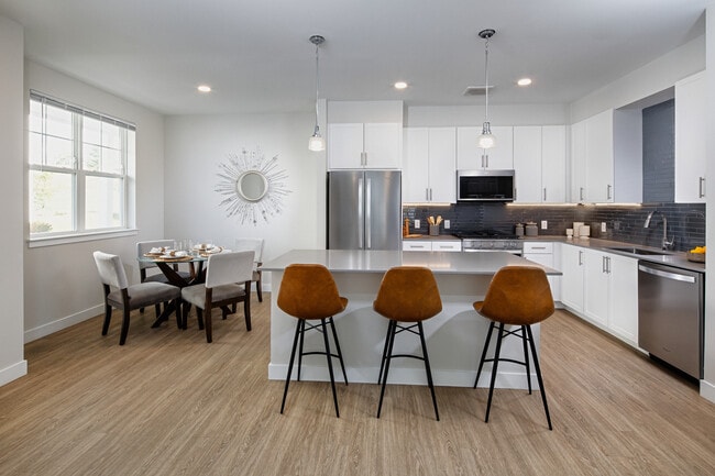 Renovated Package II kitchen and dining areas with hard surface flooring