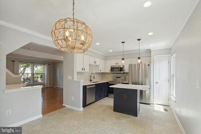 Photo - Amazing, updated end unit townhome backing to trees and open common area in Centre Ridge neighbor...
