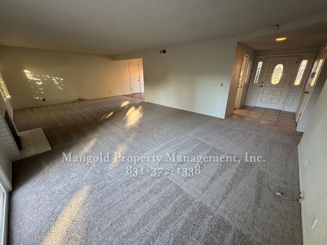 Photo - Beautiful 4-bed 2-bath Home with Cozy Fireplace and Large Backyard!
