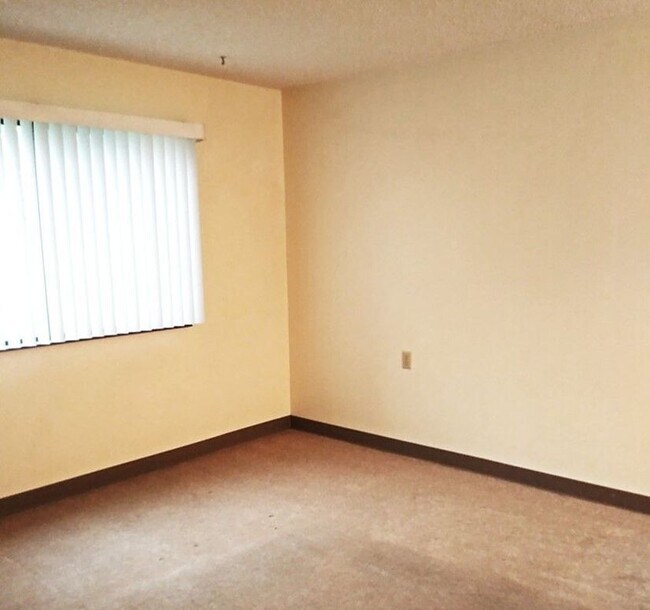 Living room area one of 2 large windows