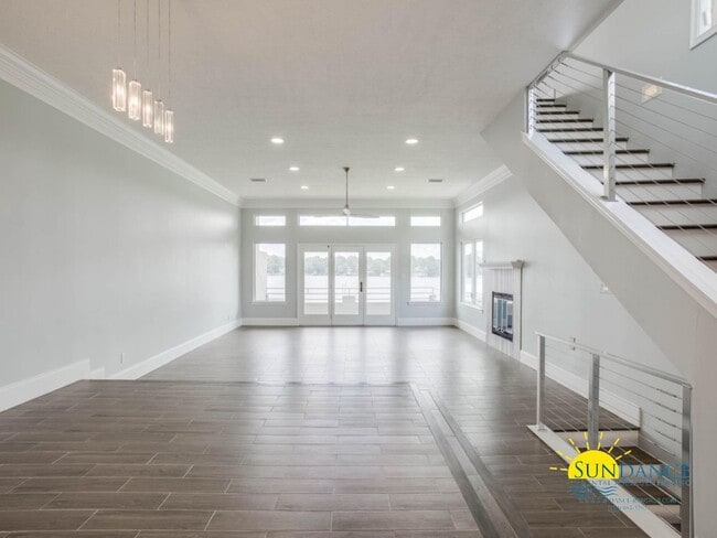 Building Photo - Updated Waterfront Townhome with Incredible Features and Boat, Jet Ski Lifts & Tesla Charger!