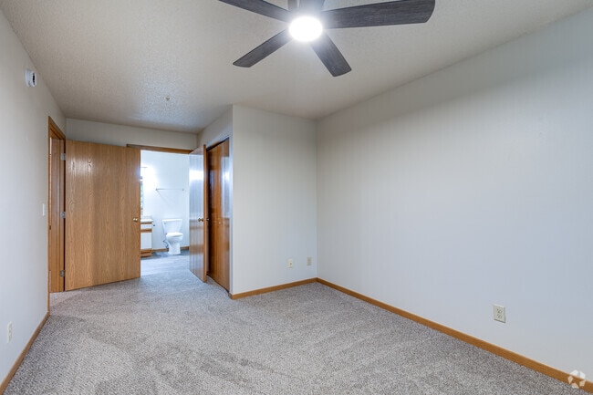 2BR, 1BA - 915SF - Primary Bedroom and Bathroom