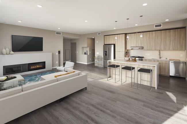 Colección exclusiva cocina de estilo penthouse, área de comedor, y sala de estar con chimenea y pisos de superficie dura. - Avalon Belltown Towers