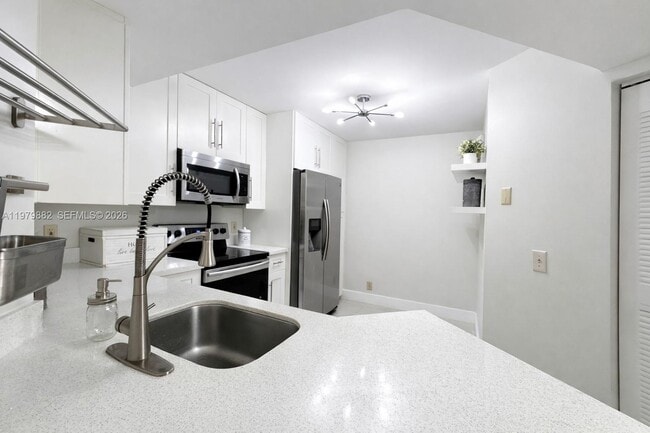 Photo - 8851 Wiles Rd Unit 106