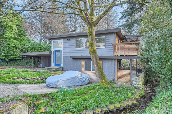 Front of house. Entrance to unit is bottom right wooden gate. - 1045 NE 115th St Rental