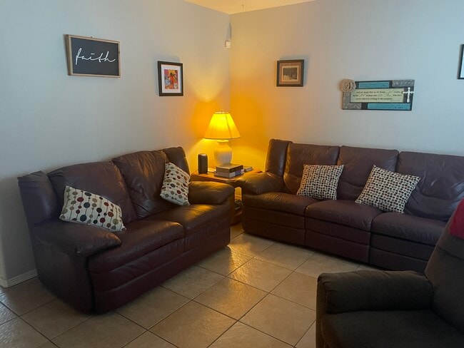 Living room with two couches and end tables with lamps - 2607 Ringold Cir Unit B Furnished Apt