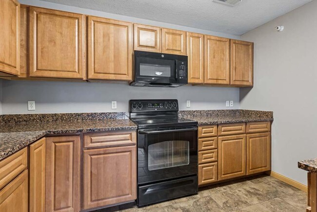 Classic cabinetry, generous counter space, and a functional layout make this kitchen as practical as it is inviting.