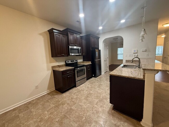 Photo - Spacious 4BR Home with Large Fenced Yard & Prime Location