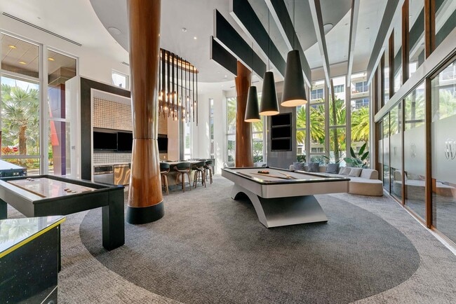 Break, play, and unwind around a modern billiards table that brings energy and friendly rivalry to the heart of the lounge