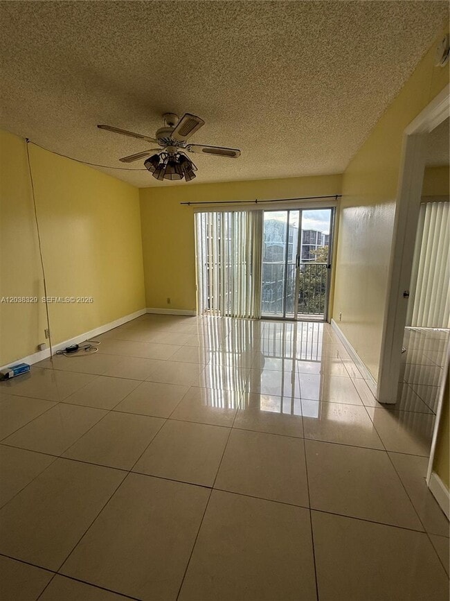 Building Photo - 8740 N Sherman Cir Unit 402
