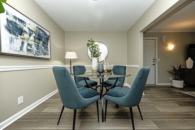 Dining area with built in lighting and wood inspired flooring