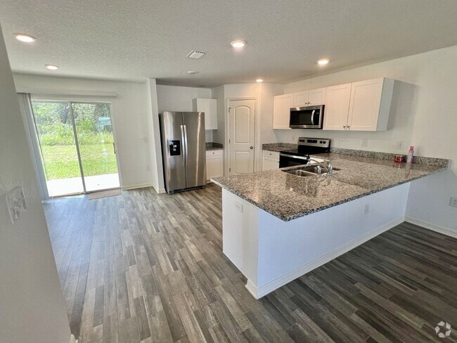 Building Photo - Spacious 4-Bedroom Home with Primary Suite...