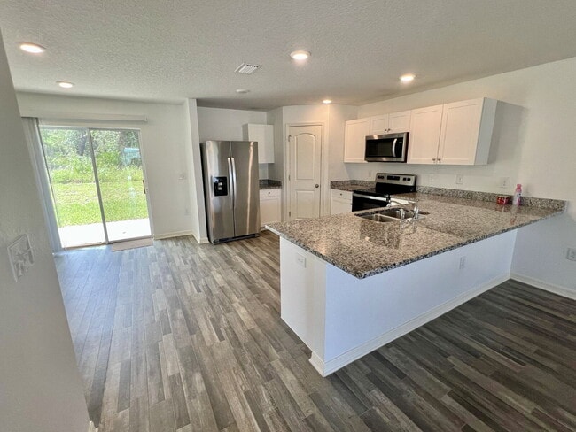 Building Photo - Spacious 4-Bedroom Home with Primary Suite...