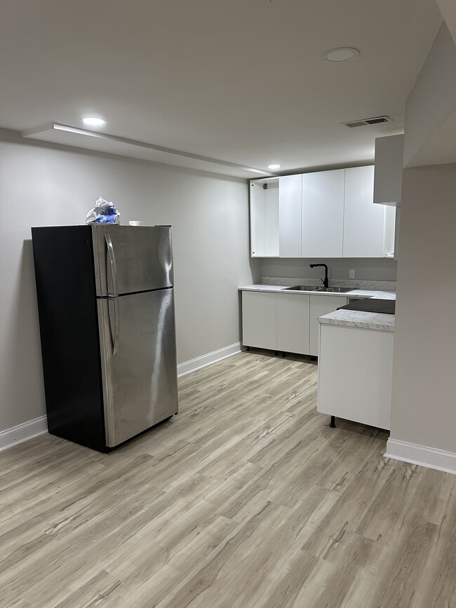 Newly renovated Kitchen with ample storage and electric stove. - 18712 Capella Ln Apartment