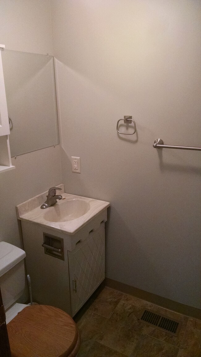 1/2 bath off of kitchen near back entry