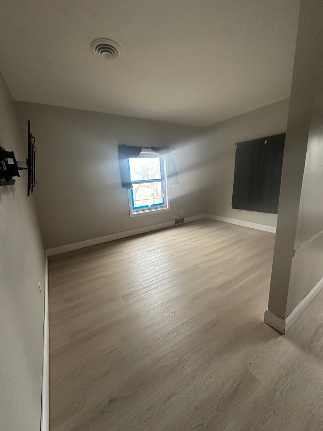 Living Room - 301 E 6th St Unit Golden Acres LLC