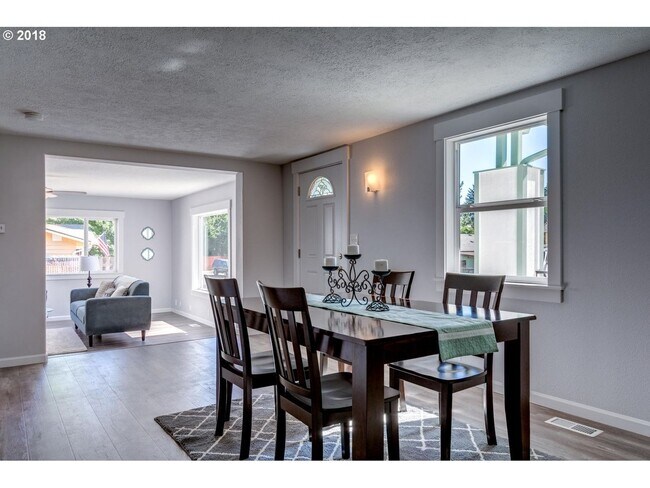 Photo - Charming Two-Story 3-Bedroom Residence Featuring Hardwood Floors, Modern Kitchen, and Outdoor Deck