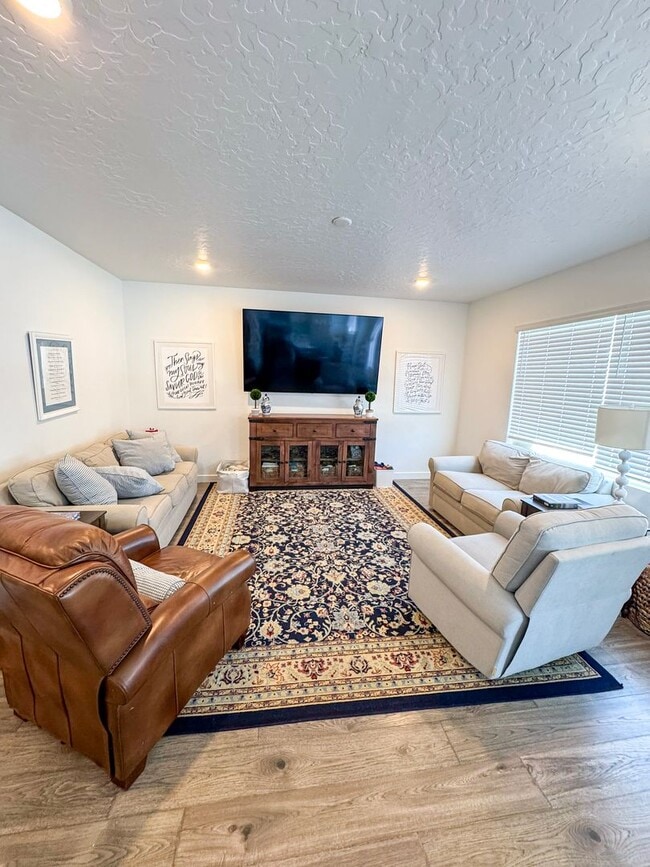 Photo - Beautiful 4 Bed 3.5 Bath Home in Syracuse + Bonus Room + Fenced Yard + 86” TV Included
