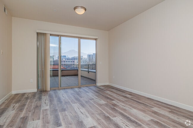 1BR, 1BA - 854SF - Living Room w/Balcony - The Vue at Sugar House