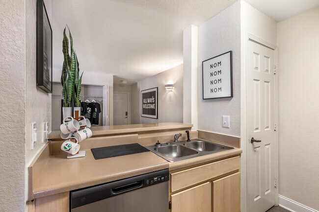 Explore the charm of this chic apartment kitchen, where style meets functionality.
