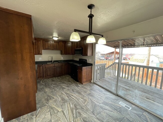 Photo - Spacious 6-Bedroom Magna Home with Fenced Yard