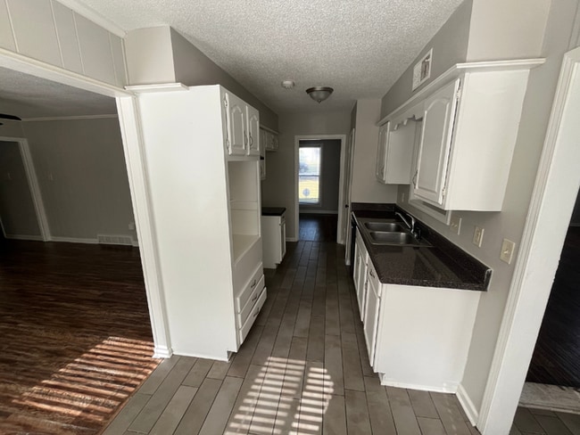 Photo - Spacious 4BR/2BA Memphis Home | 1,913 Sq Ft, Hardwood Floors, Brick Fireplace & Fenced Yard