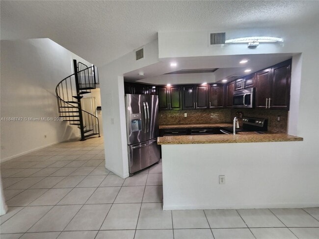 Building Photo - 8335 SW 152nd Ave Unit B-402 Rental