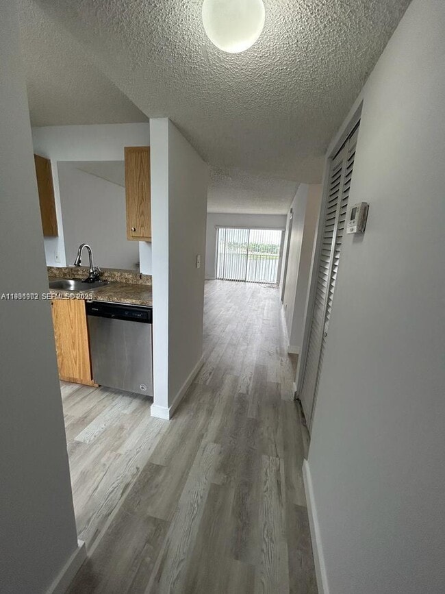 Building Photo - 8600 N Sherman Cir Unit 406