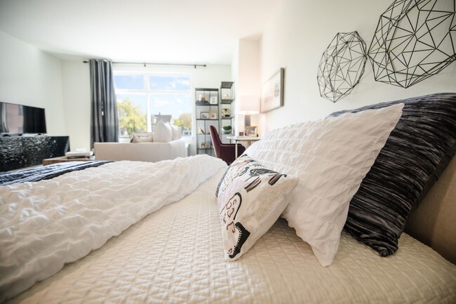 The George Besaw Apartments Bed and Pillows - The George Besaw