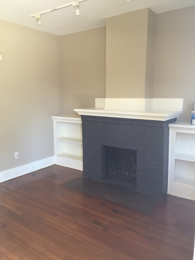 Living room w wood burning fireplace and built in cabinets - 1926 Harold St