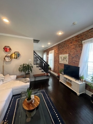 Exposed brick and original hardwood floors.