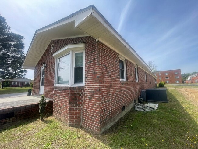 Photo - Brick Ranch- Dunn- 4 bedroom 2.5 bath- 2 car carport- Corner Lot
