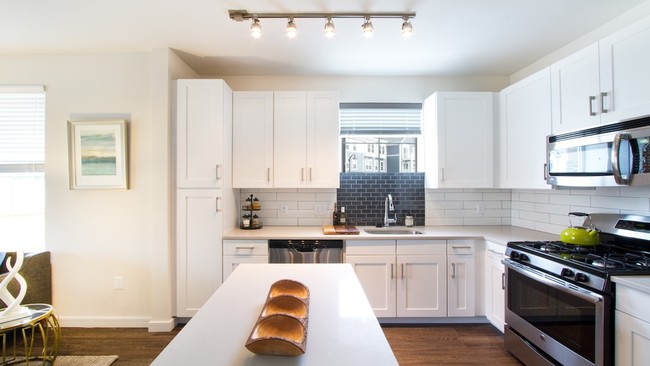 Quartz countertops, stainless steel appliances and custom cabinets in our contemporary kitchens