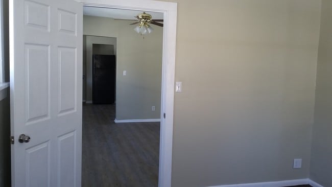 View into LR from main floor BR - 1518 Irving Ave N Unit 2