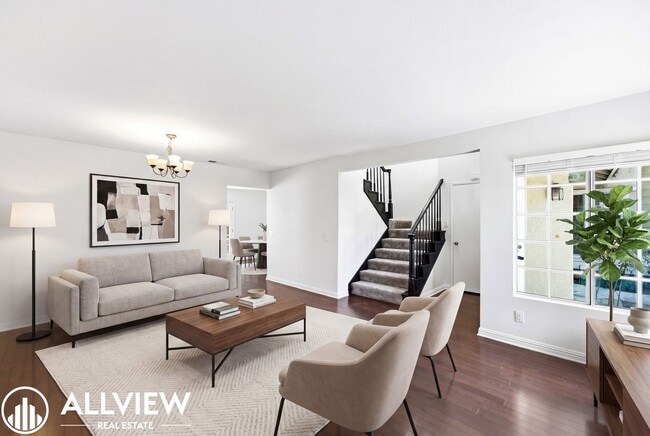 Building Photo - Fully Renovated 2 Bed Townhome with Private Patio, 2-Car Garage & Community Pool