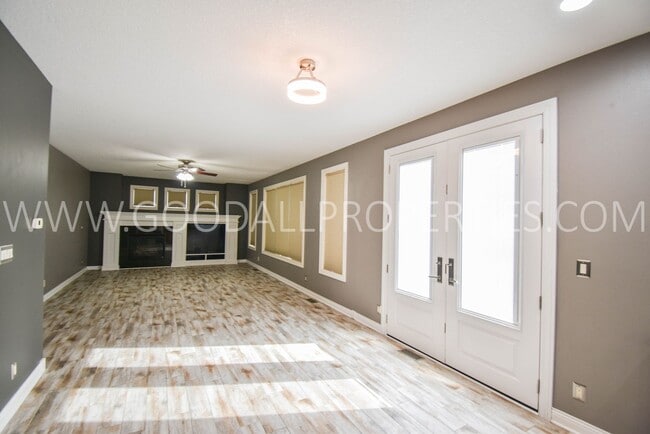 Photo - 4 Bedroom 4 Bath Executive Home in West Des Moines with a fenced in yard and a 3-car garage