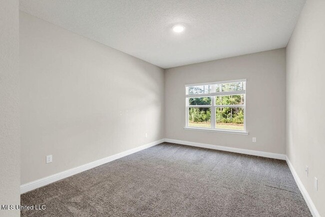 Photo - | 3,100+ Sq Ft • Gourmet Kitchen • Covered Patio • Ocean Springs Schools