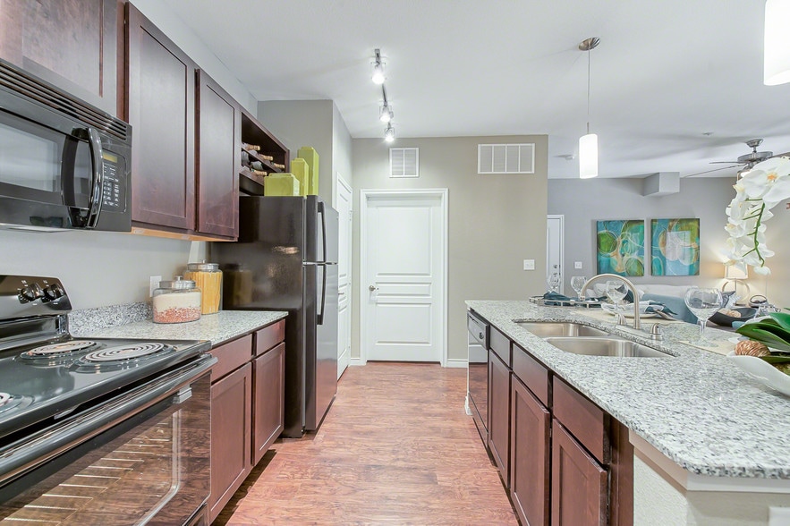 Latigo at Eagle Pass Kitchen with Black Appliances and Granite Countertops